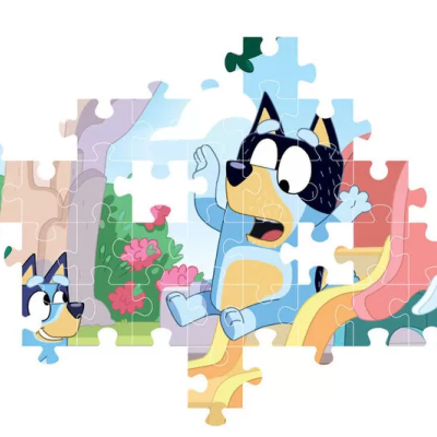 Quebra-cabeças incompleto com personagens de cães azuis num parque colorido