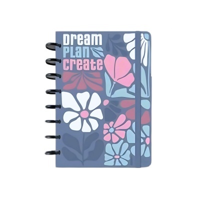 Caderno azul com flores coloridas e texto dream PLAN create na capa
