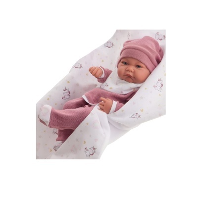 Boneca bebê vestida com roupa rosa e branca e manta branca com estampados