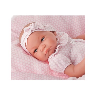 Boneca bebé rosa com body e faixa na cabeça de bolinhas