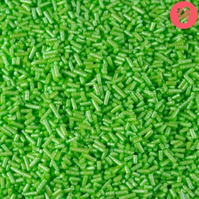 Granulado verde brilhante cilíndrico com textura glitter