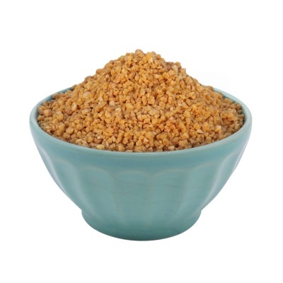 Tigela azul com granulados amarelos-alaranjados