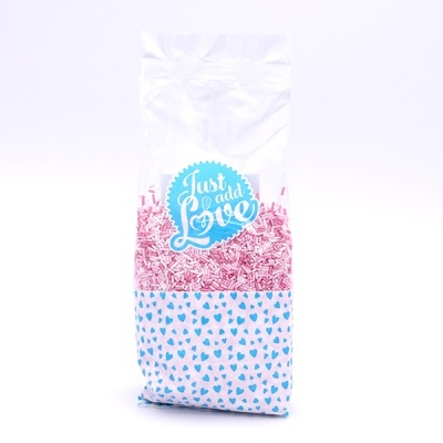 Pacote com confetes rosas e texto Just add Love