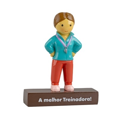 Estatueta colorida de treinador com texto A melhor Treinadora na base