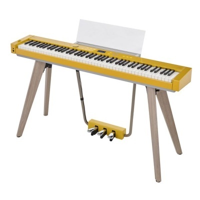 Piano digital amarelo com suporte de madeira e três pedais