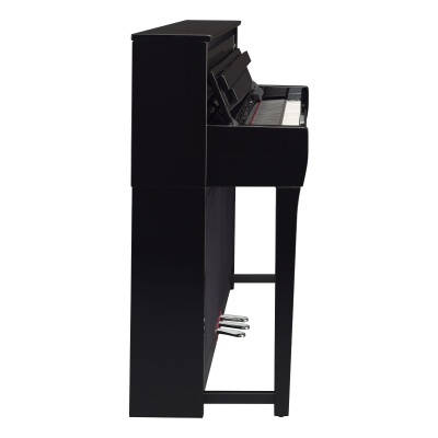 Piano digital preto visto de lado com três pedais