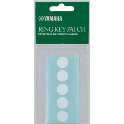 Embalagem do produto Yamaha Ring Key Patch com adesivos circulares brancos sobre fundo azul claro