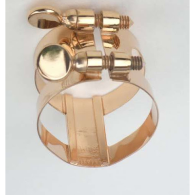 Anel dourado de metal com peças de rosca sobre fundo branco