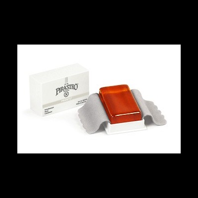 Bloco de resina alaranjada com pano cinzento e caixa branca PIRASTRO