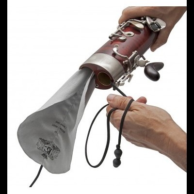 Clarinet with cleaning cloth and adjusting cord on white background