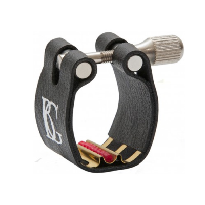 Abraçadeira preta e dourada para instrumento musical com símbolo branco e ajuste prateado.