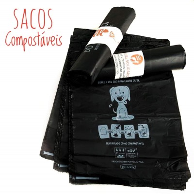 Sacolas compostáveis pretas com desenho de cão e texto certificação TÜV, com duas rolos enrolados e texto 'SACOS Compostáveis' em vermelho.