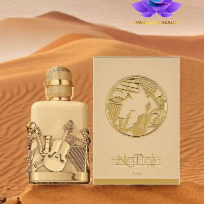 Frasco de perfume creme e dourado com instrumentos musicais em relevo e caixa com texto No Limits Jazz