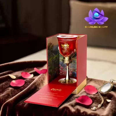 Frasco de perfume vermelho BAHIYA RUBY ARABIYAT PRESTIGE em caixa vermelha aberta