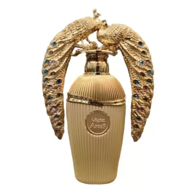 Frasco de perfume dourado com pavões decorativos