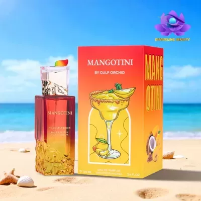 Frasco de perfume MANGOTINI junto à sua embalagem colorida na praia