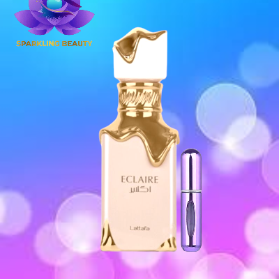 Frasco de perfume ECLAIRE Lattafa creme e dourado com pulverizador roxo ao lado
