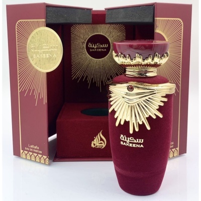 Frasco de perfume Sakeena vermelho com detalhes dourados e embalagem