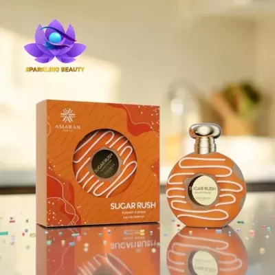 Frasco e caixa de perfume laranja SUGAR RUSH AMARAN com padrão branco ondulado e rótulo dourado