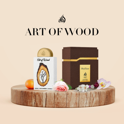 Produto Art of Wood em lata branca e caixa marrom sobre base de madeira com flores e laranja
