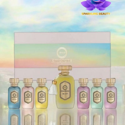 Conjunto de perfumes Emotions com garrafas coloridas e caixa branca com faixa colorida