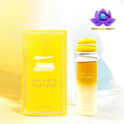 Frasco e caixa de perfume amarelos com decoração de macaron e texto dourado