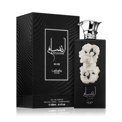 Frasco preto de perfume com flores brancas em relevo e caixa preta texturizada.