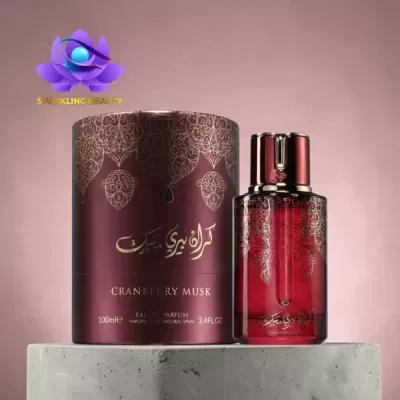 Frasco de perfume vermelho com embalagem cilíndrica bordô e detalhes dourados
