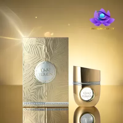 Frasco e caixa dourados do perfume YUMIN com texturas e brilho