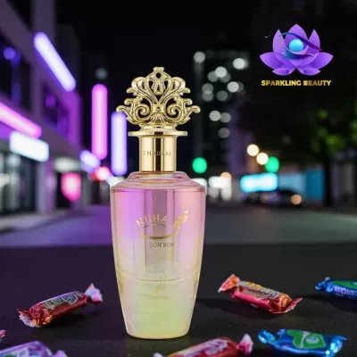 Frasco de perfume NUHA BON BON com tampa dourada e doces coloridos