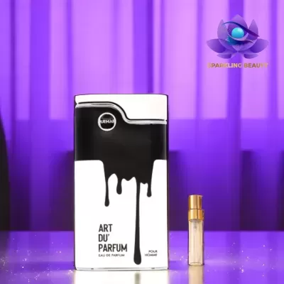 Embalagem de perfume preto e branco com texto ARTMAN ART DU PARFUM e pequeno frasco de vidro com tampa dourada