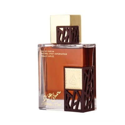 Frasco de perfume âmbar com tampa e capa decorativas douradas e castanhas