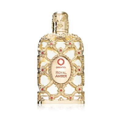 Frasco de perfume dourado ornamentado com flores vermelhas e etiqueta com texto ORIENTICA ROYAL AMBER