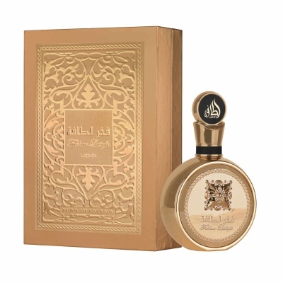 Frasco de perfume dourado com tampa preta e dourada e caixa decorativa dourada