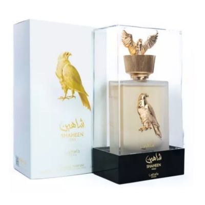 Frasco de perfume SHAHEEN com tampa em forma de falcão na caixa transparente e embalagem branca com falcão dourado