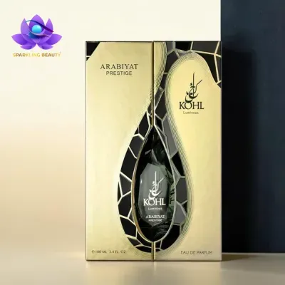 Frasco de perfume ARABIYAT PRESTIGE com embalagem dourada e preta e texto KOHL Luminous, capacidade 100 ML