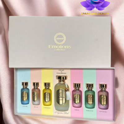 Conjunto de perfumes Armaf Emotions Collection em caixa branca sobre tecido rosa.