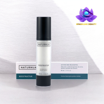 Frasco branco com tampa preta da creme facial NATURNUA REESTRUCTUR e caixa de embalagem