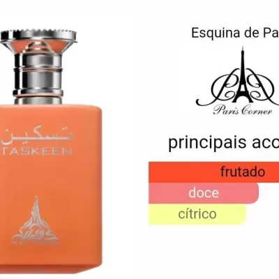 Frasco de perfume laranja fosco com tampa prateada e texto TASKEEN, descrição de fragrância ao lado.