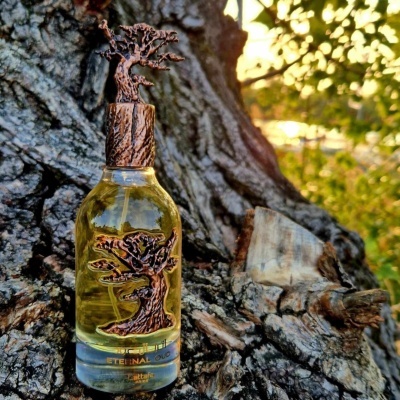 Frasco de perfume de vidro decorado com árvore bronze e tampa em formato de tronco