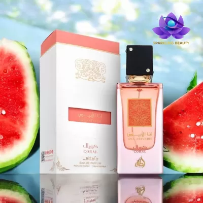 Perfume Lattafa Coral com embalagem e fatias de melancia perto