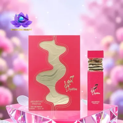 Frasco e caixa de perfume vermelho e dourado Habiba ARABIYAT PRESTIGE sobre base translúcida rosa