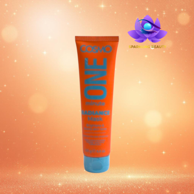 Máscara facial COSMO ONE minute Radiance Mask em tubo laranja com tampa azul sobre fundo brilhante dourado