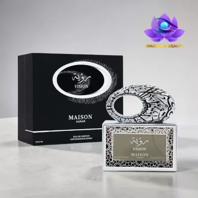 Frasco de perfume com tampa oval decorada e caixa preta com texto Vision Maison Asrar