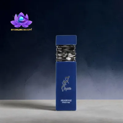 Frasco de perfume azul ARABIYAT PRESTIGE com tampa prateada ondulada.