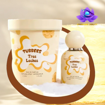 Perfume TUBBEES Tres Leches com frasco creme e amarelo e embalagem cilíndrica decorada