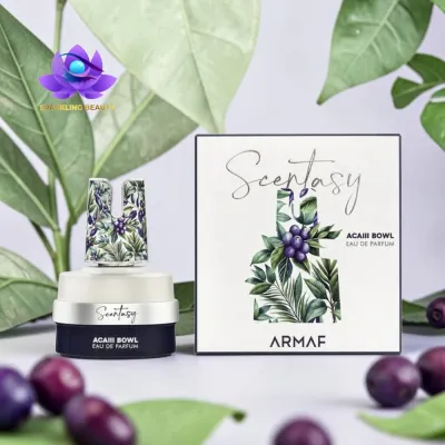 frasco e caixa de perfume Scentasy Acaiii Bowl com design de folhas e bagas roxas