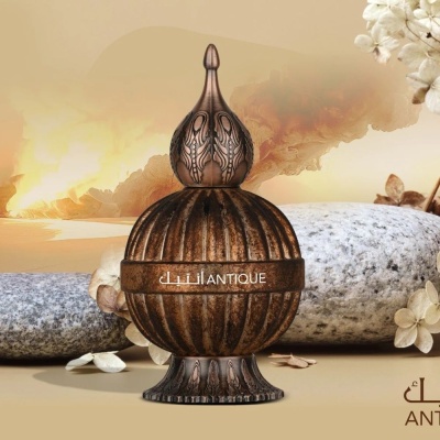 Frasco decorativo marrom envelhecido com tampa pontiaguda e inscrições douradas