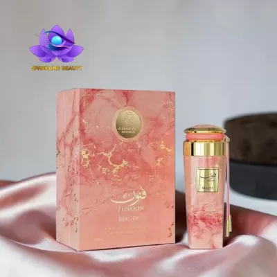Caixa e frasco de perfume rosa marmoreado com dourado e texto FUNOON BEAUTY