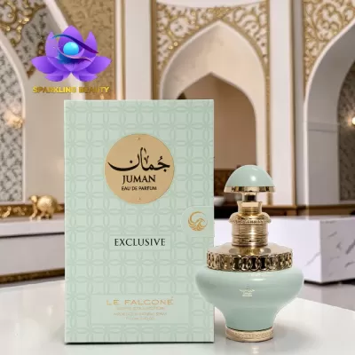 Perfume JUMAN EAU DE PARFUM EXCLUSIVE LE FALCONÉ com frasco verde claro e dourado, sobre mesa branca e fundo arquitetônico decorado